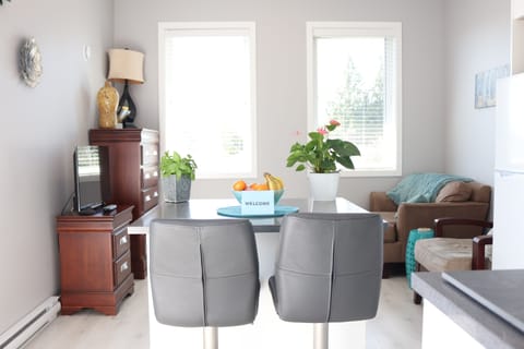 A SOUTH FACING VIEW OF THE LIVING ROOM WITH MOUNTAIN VIEWS TO YOUR LEFT!