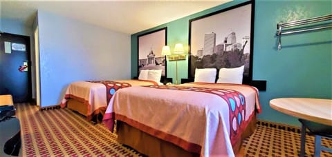 Desk, laptop workspace, iron/ironing board, free cribs/infant beds