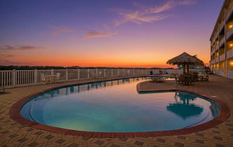 Resort Pool at Sunset — Stunning Purple & Orange Sky Reflected in Pool