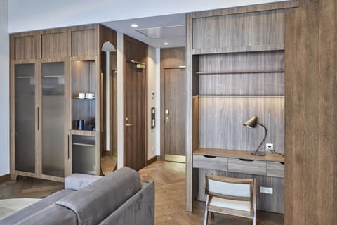 Luxury Suite | Living area | 49-inch LED TV with satellite channels, TV, heated floors