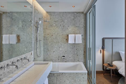 Luxury Suite | Bathroom | Hair dryer, slippers, towels, soap