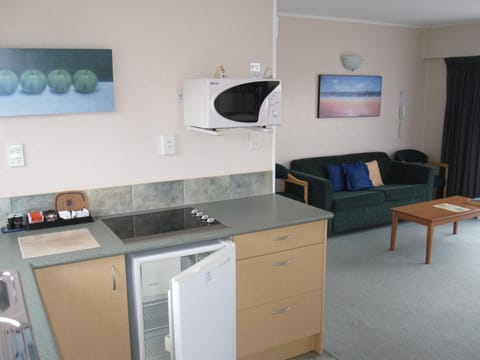 Fridge, microwave, stovetop, coffee/tea maker