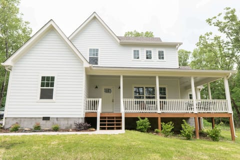 Front view of home with wrap around porch.