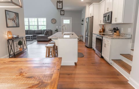 Dining room table and kitchen.