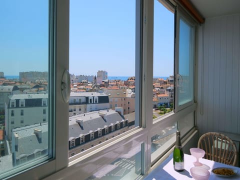 Sky, Table, Building, Property, Furniture, Window, Tableware, Chair, House