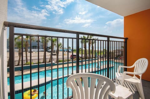 Morning sun, poolside charm—your balcony is the perfect hideaway.

