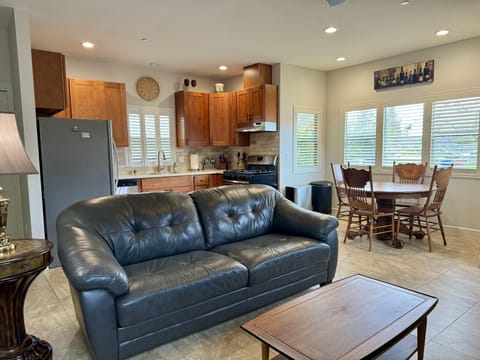 Open living room /kitchen.  Tile flooring throughout.  Shutters adjustable.  