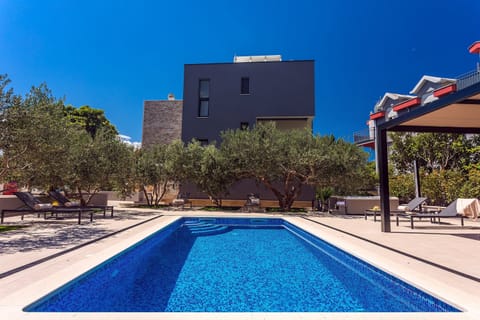 Private heated pool, outdoor dining area  with barbecue, perfect for relaxing