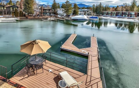 A tranquil marina setting with snow-capped mountains providing a stunning backdrop to the area's year-round recreational opportunities.