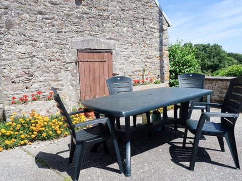 Furniture, Plant, Table, Flower, Chair, Building, Outdoor Table, Outdoor Furniture, Wood, Shade