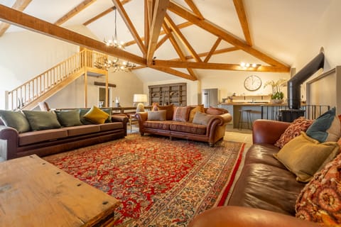 The Owl House, Little Massingham: Spacious open-plan living area with wood burning stove