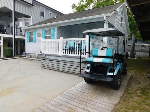 Cozy porch retreat with convenient golf cart access