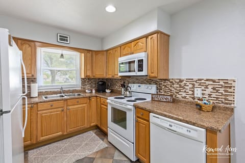Fully stocked kitchen with all cooking and eating utensils 