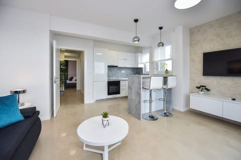 Deluxe Apartment, 3 Bedrooms, Non Smoking, Terrace | Living area | 45-inch flat-screen TV with satellite channels, TV