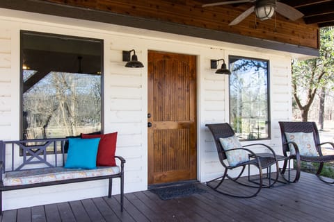 Oversized front porch, enjoy coffee or cocktails while overlooking the pond