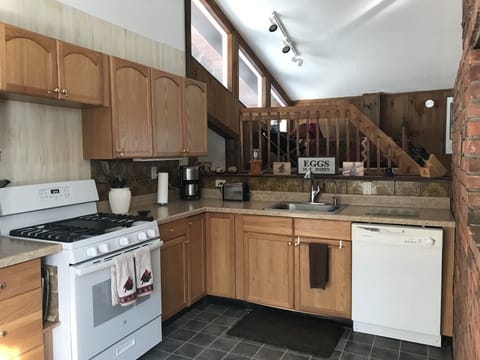 kitchen- view of range, dishwasher and plenty of counter space