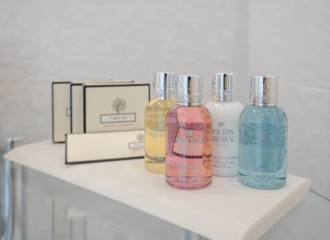 Shower, rainfall showerhead, designer toiletries, hair dryer