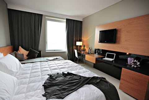 Premium bedding, down comforters, minibar, in-room safe