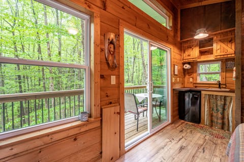 No curtains needed in the tree tops! Reclaimed wood, tin, tongue/groove pine.
