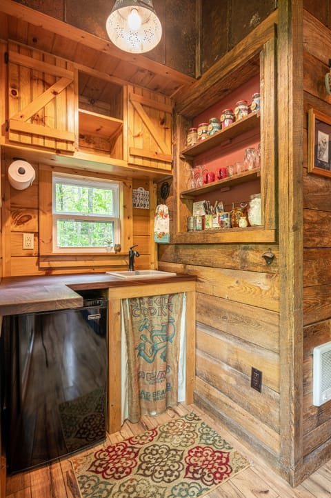 Glamping kitchen supplied to make simple meals with access to gas grill