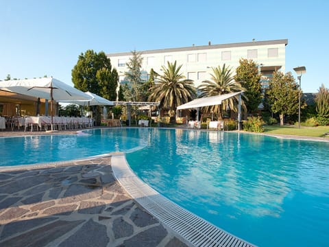 Outdoor pool, open 10:00 AM to 7:00 PM, pool umbrellas, sun loungers