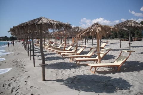 Beach nearby, white sand, sun loungers, beach umbrellas