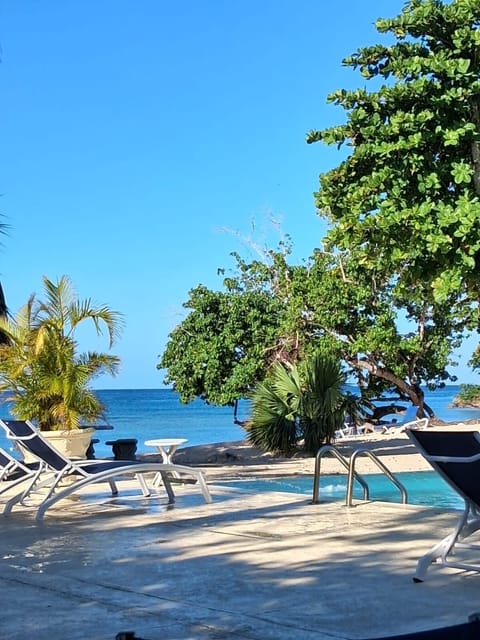 Beautiful house in a gated community Located on the beach steps from large pool
