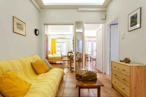 Welcoming Living Room with Balcony Access
Shared space with cozy furnishings, direct access to the balcony, and a homey atmosphere perfect for relaxing or reading.