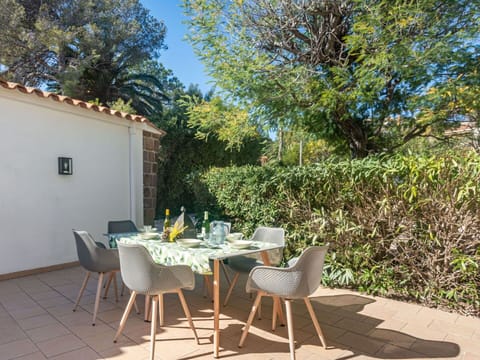 Furniture, Plant, Table, Chair, Building, Shade, Outdoor Furniture, Outdoor Table, Tree, Architecture