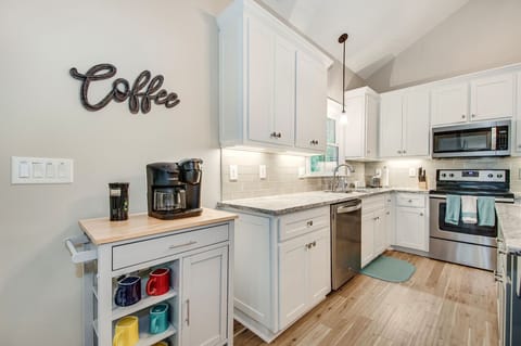 Coffee cart with combination pot/individual coffee maker and coffee grinder.