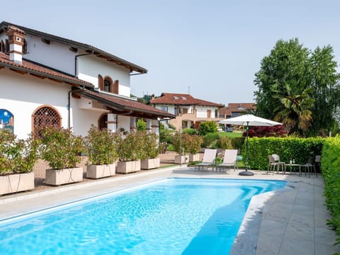 Plant, Sky, Furniture, Property, Building, Chair, Swimming Pool, Azure, Outdoor Furniture, Shade