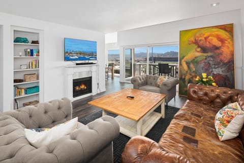 Big comfy Restoration Hardware couch and a TV with plenty of streaming apps!
