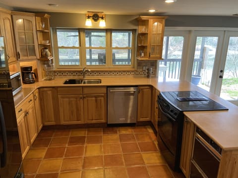 Fully stocked kitchen with Pots, pans, serving disk ware, 12+ place set,