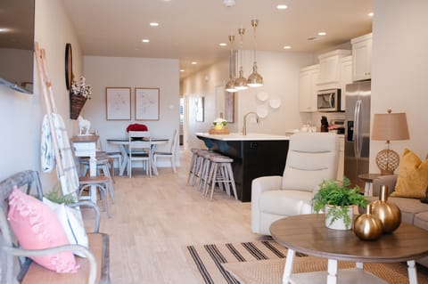 Spacious open-concept living area with modern décor and comfortable seating.