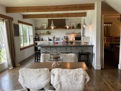 Dining area. 1st floor bedroom drape door way.