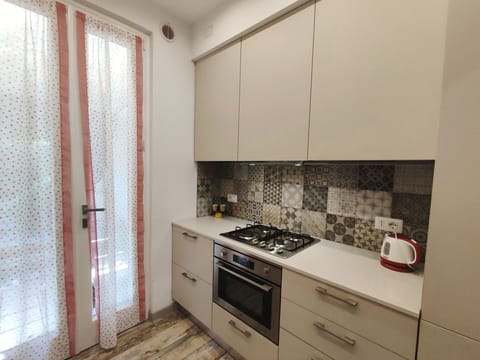 Countertop, Cabinetry, Property, Building, Kitchen Stove, Drawer, Wood, Kitchen, Interior Design, Kitchen Appliance