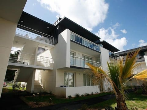 Walk to your accommodations through lush, tropical gardens.