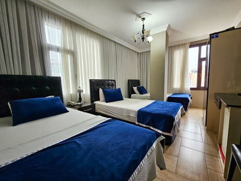 Triple Room | In-room safe, blackout drapes, free WiFi