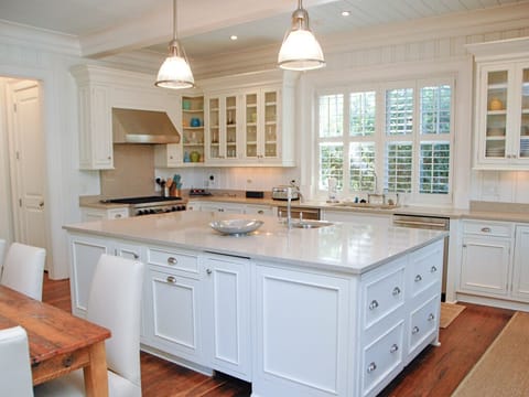 Gourmet kitchen including a 6-burner gas stove, two ovens (one convection), 2 dishwashers