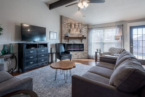 Open living space with fireplace and plenty of natural light