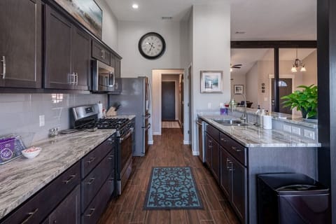 Fully stocked kitchen with island and open layout.