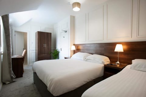 Premium Triple Room | Premium bedding, desk, laptop workspace, blackout drapes