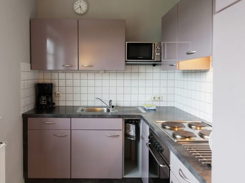Apartment | Private kitchen | Stovetop, highchair