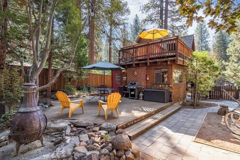 Deck and patio in back yard (chiminea pictured is not available for guest use)