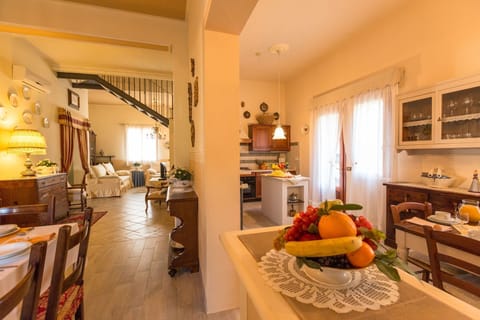 Food, Cabinetry, Countertop, Furniture, Table, Shelf, Houseplant, Orange, Tableware, Lighting