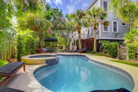 Backyard paradise with pool and hot tub.