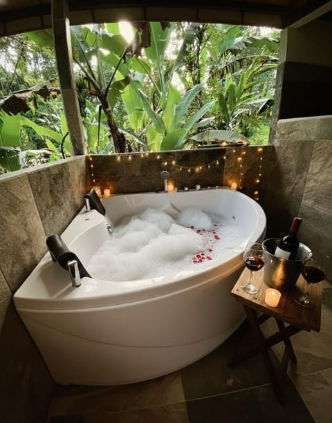 Honeymoon Cabin, 1 Double Bed, Jetted Tub, Mountain View | Bathroom | Shower, hydromassage showerhead, free toiletries, towels