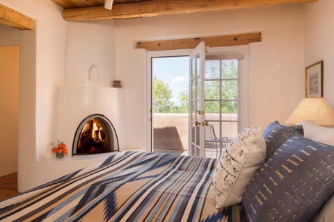 Master Bedroom with Kiva fireplace and view deck