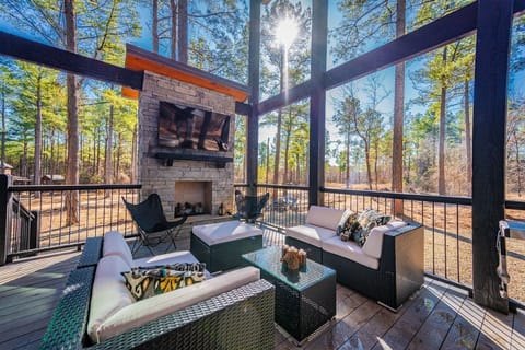 Unwind on the spacious deck with an outdoor fireplace and cozy seating under the stars.