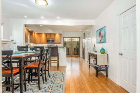 The open concept dining room and kitchen offers an abundance of space for several cooks in the kitchen and friends and family to dine. Easy access through the slider to the outdoor patio allows for additional living space.